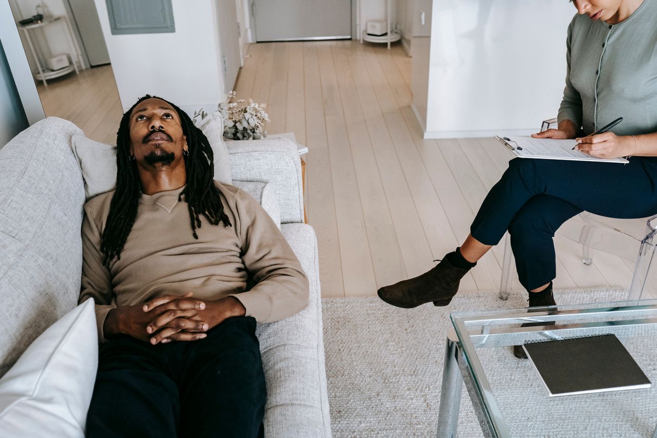 Counsellor and client in a calm, supportive conversation
